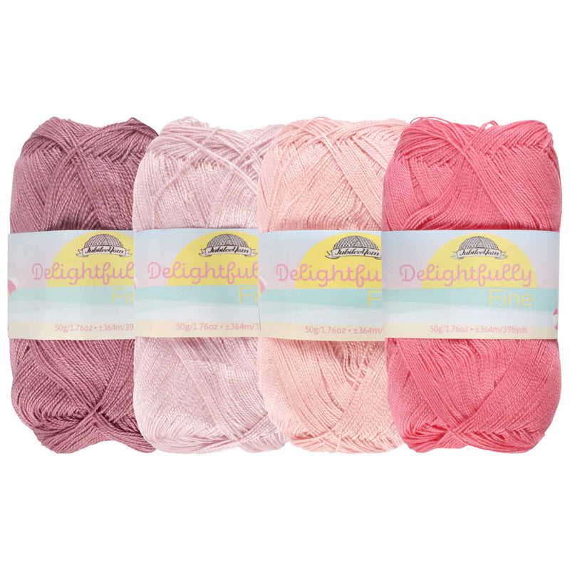 group of 4 yarn side by side of likewise colors (pink) 