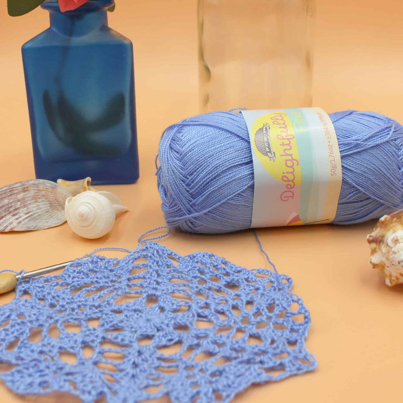 blue yarn with items near it laying down