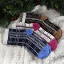 3 socks of the same pattern but different color laying on blanket