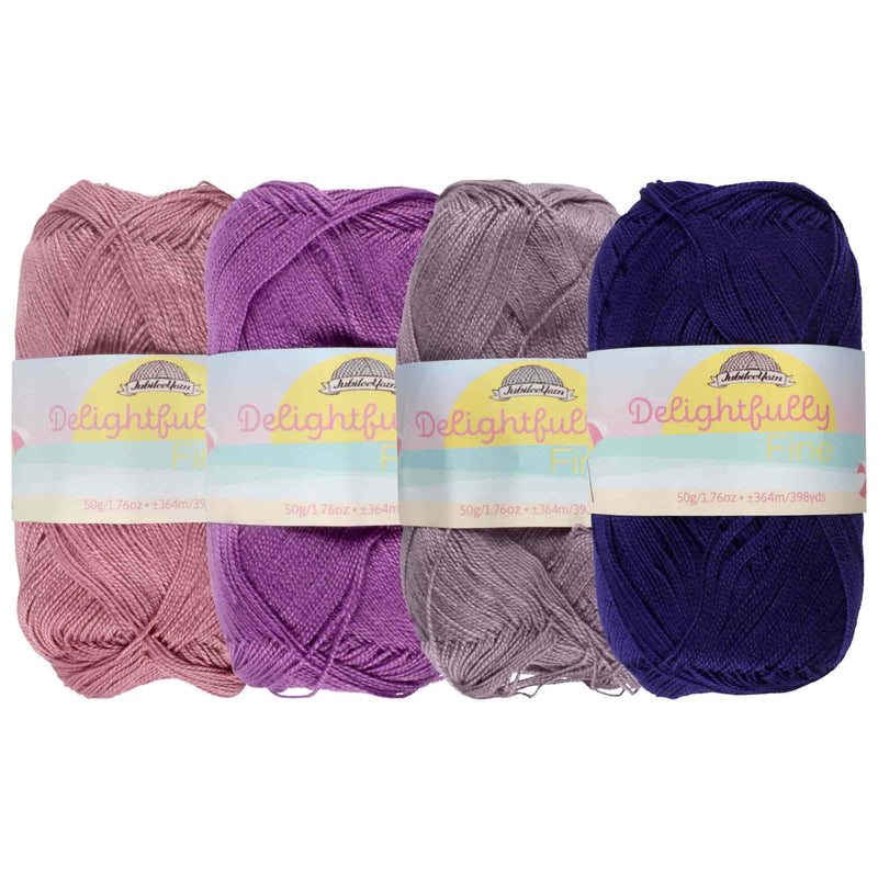 group of 4 yarn side by side of likewise colors (purple) 