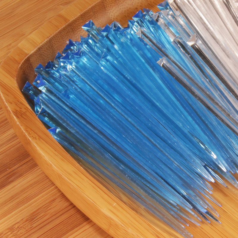 4.5" light blue prism plastic skewer picks on bamboo wood