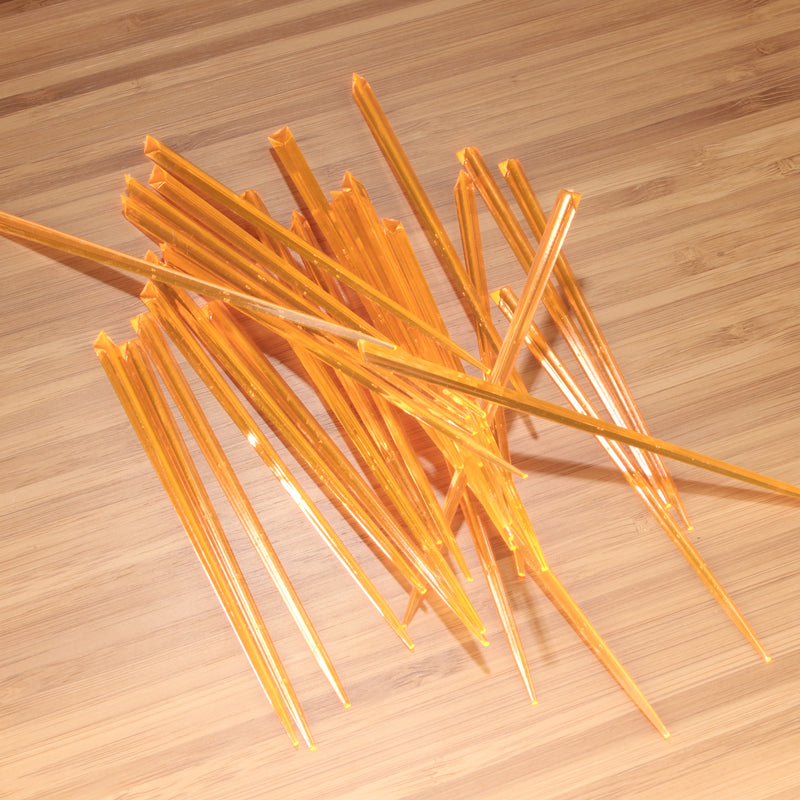 4.5" orange prism plastic skewer picks on bamboo wood