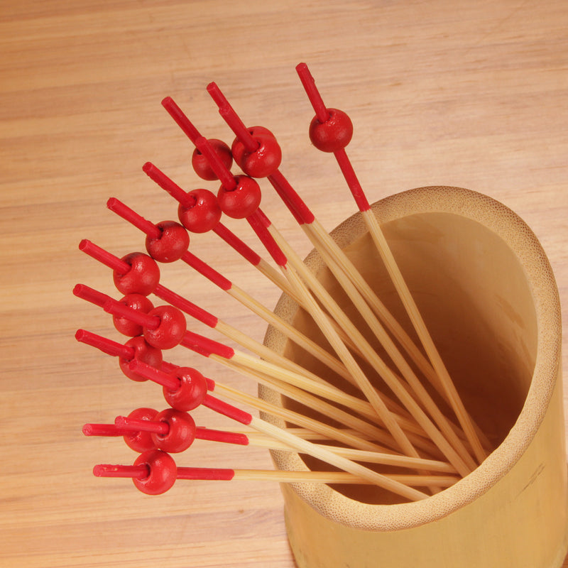 red dipped bamboo ball picks displayed