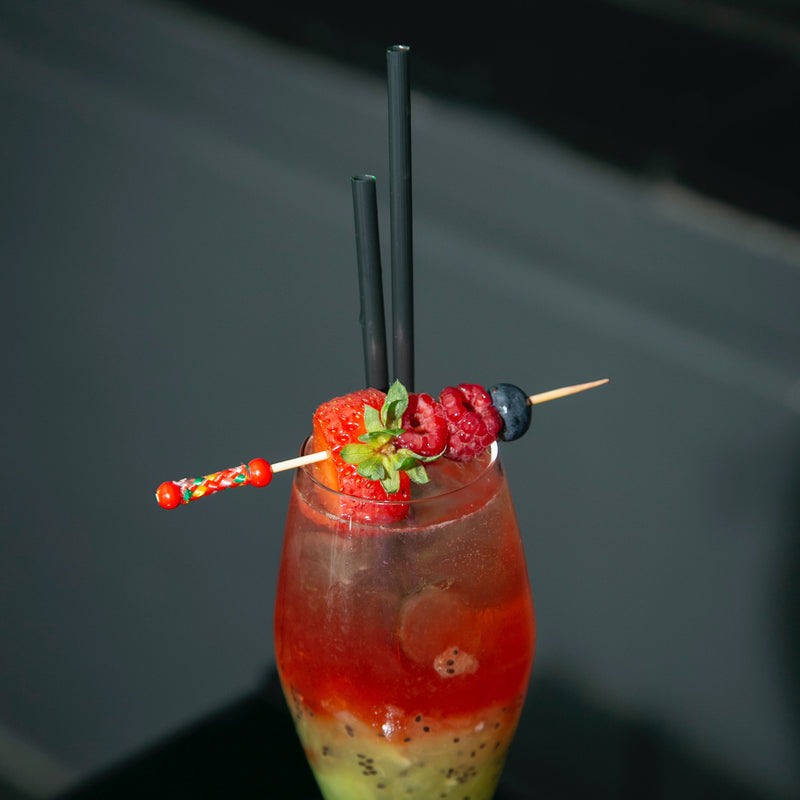 string braid pick cocktail drink strawberry raspberry blueberry garnish fruit