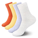 assortment of fuzzy socks in orange, yellow, blue and white