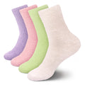 assortment of pastel colored socks in lavender purple, pink, green, and off white