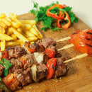 bamboo arrow pick skewers steak kebabs fries peppers onions tomatoes cutting board seasoning