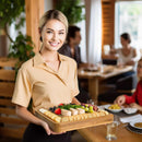 Hostess serving charcuterie at a party