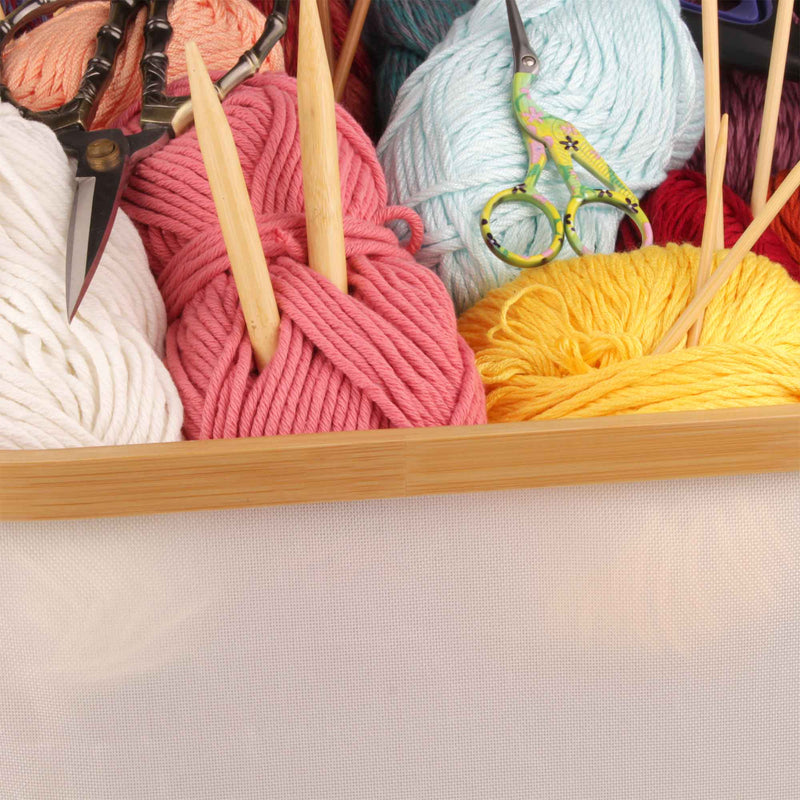 Closeup photo of basket with knitting supplies inside