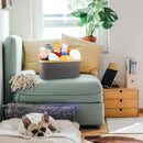 Lifestyle photo of crafting bin on top of a chair full of yarn balls and skeins