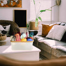 Lifestyle image of crafting basket full of supplies in a living room on a table