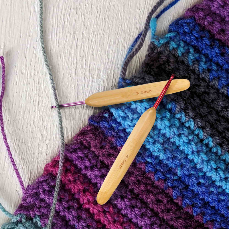 crochet hooks making a blanket
