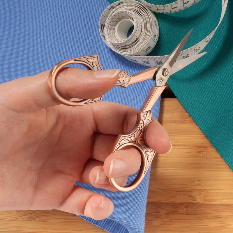 Embroidery Scissors with Decorative Antique Style Handles In Hand