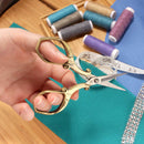 Embroidery Scissors with Decorative Chinese Wing and Cloud Motif Handles In Hand