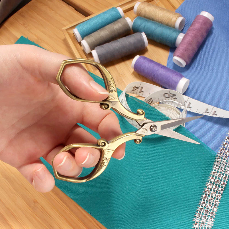 Embroidery Scissors with Decorative Chinese Wing and Cloud Motif Handles In Hand
