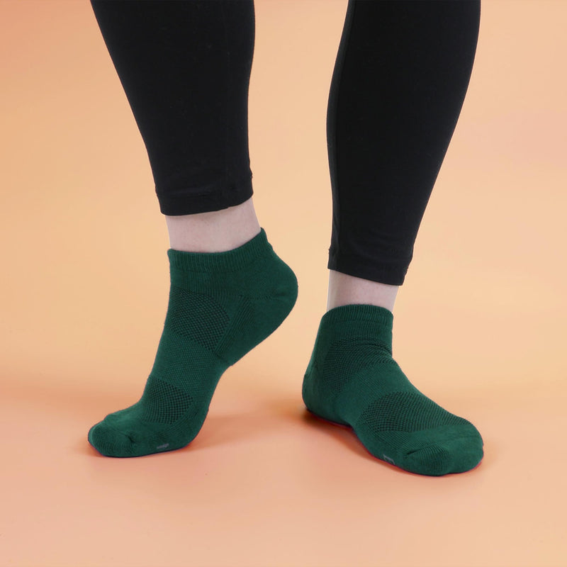 Person wearing green low cut socks
