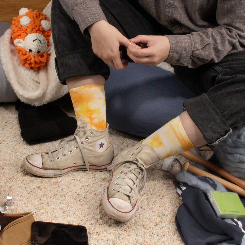 Yellow tie dye socks worn with shoes