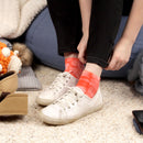 Person wearing tie dye socks