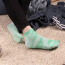 Person wearing tie dye socks