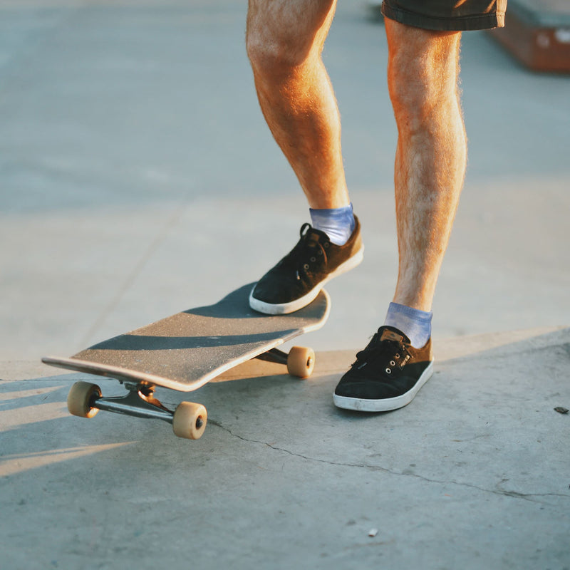 Person skateboarding with tie dye socks