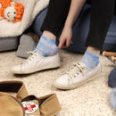 Person wearing tie dye socks