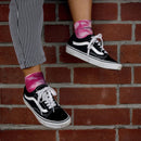 Person wearing purple tie dye socks