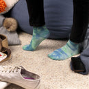 Person wearing tie dye socks