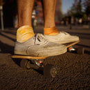 Person skateboarding with tie dye socks