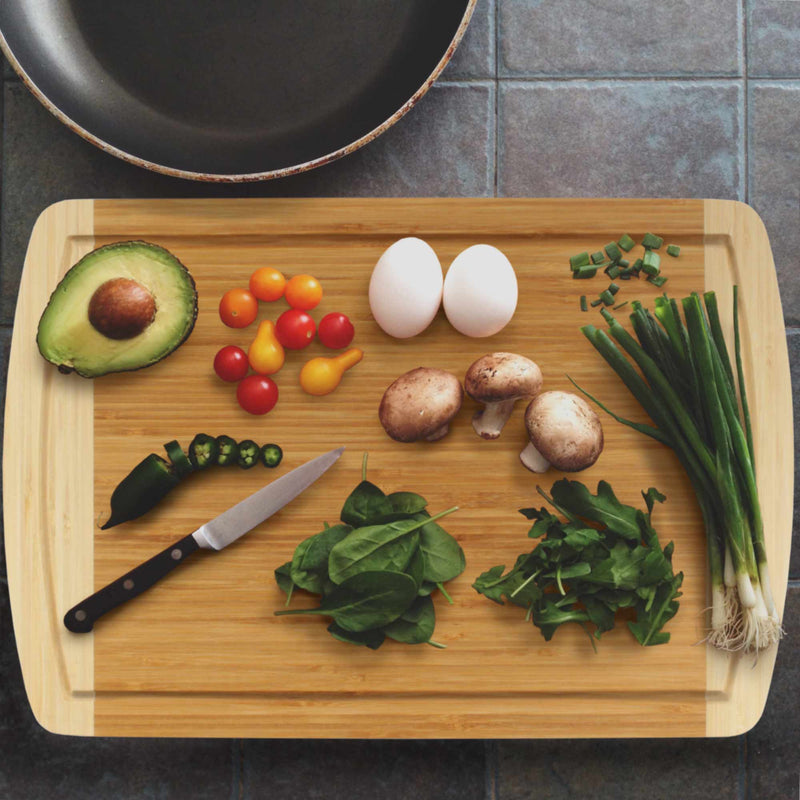 bamboo two tone cutting board grooved lifestyle image with food 