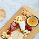 bamboo two tone cutting board and serving board lifestyle image with food