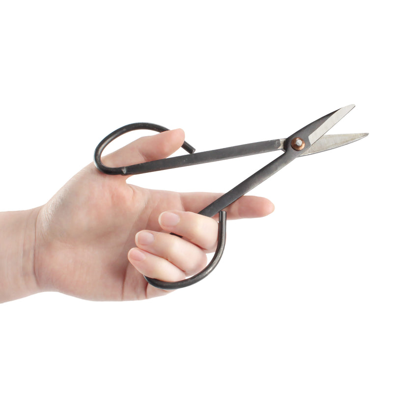 black bonsi trimming shear tool in hand