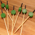 green circle picks on bamboo board