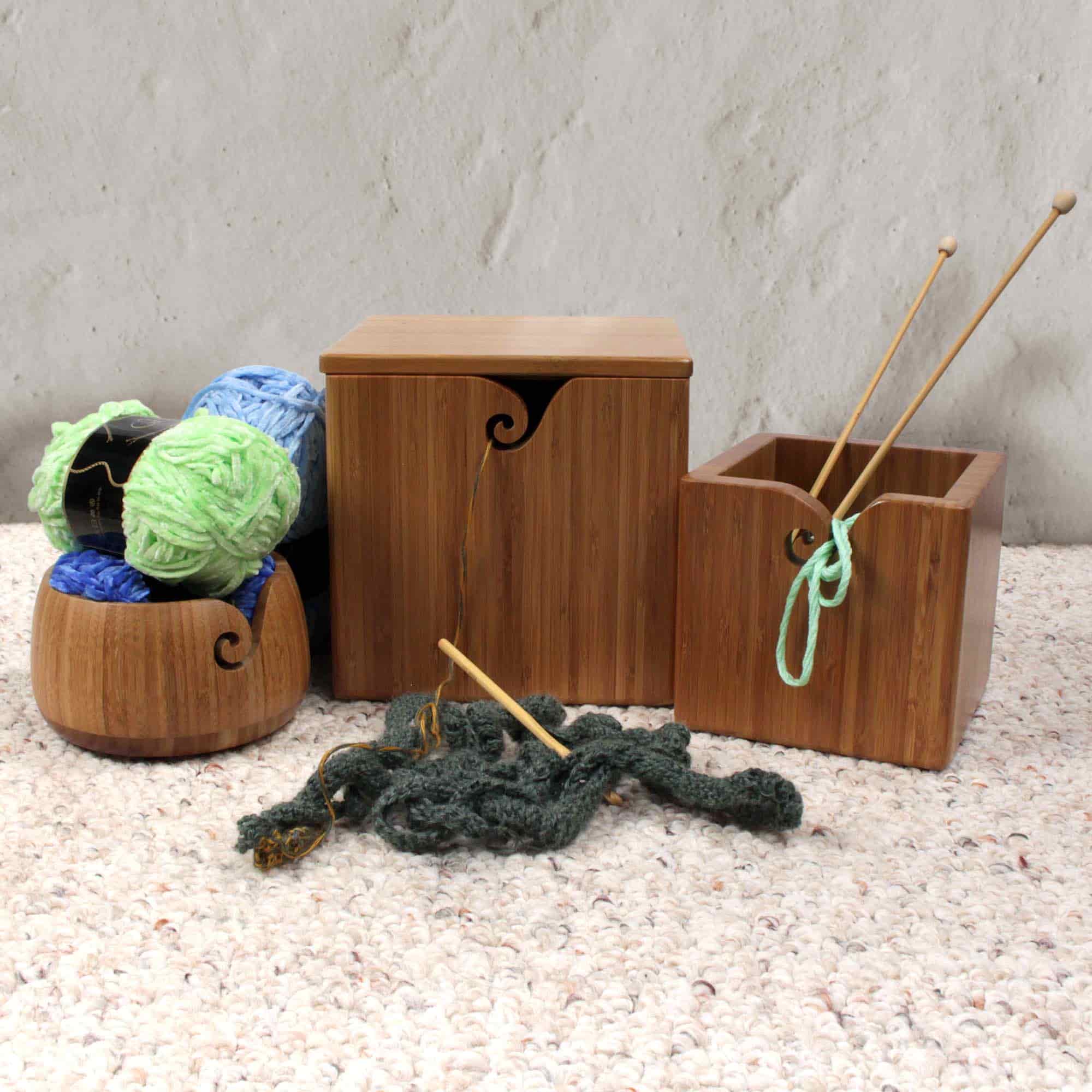 box with smaller boxes near it inlcuding yarn