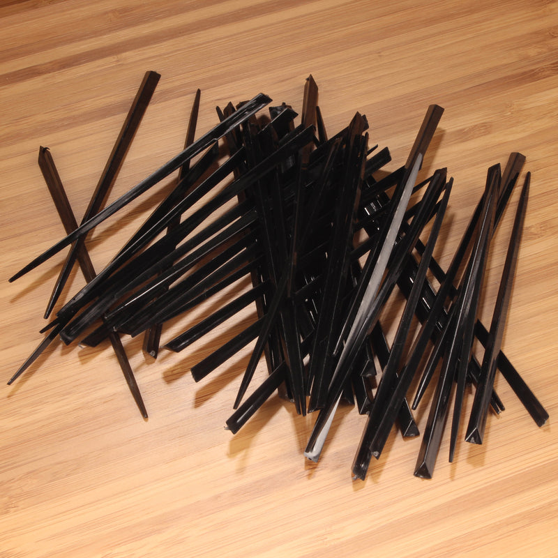 3.5" black prism plastic skewer picks on bamboo wood
