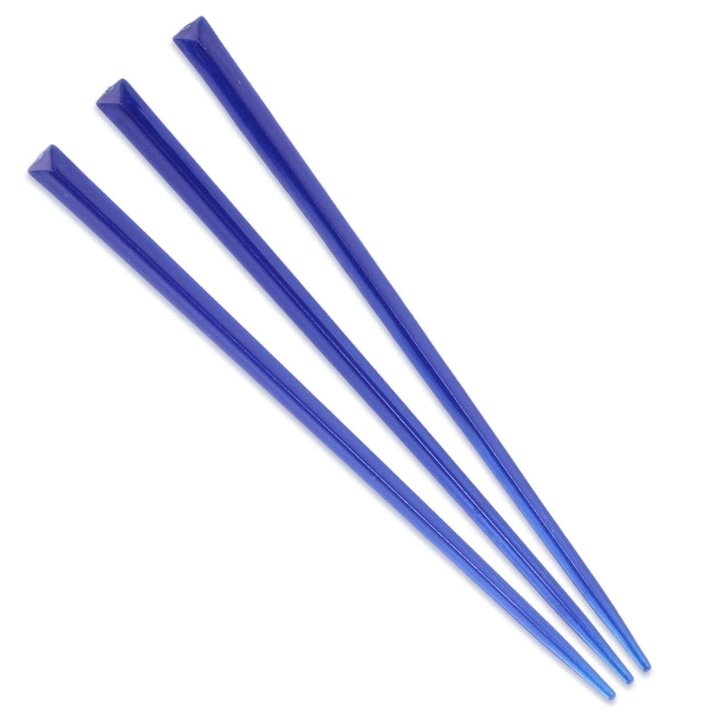 dark blue prism plastic skewer picks on white