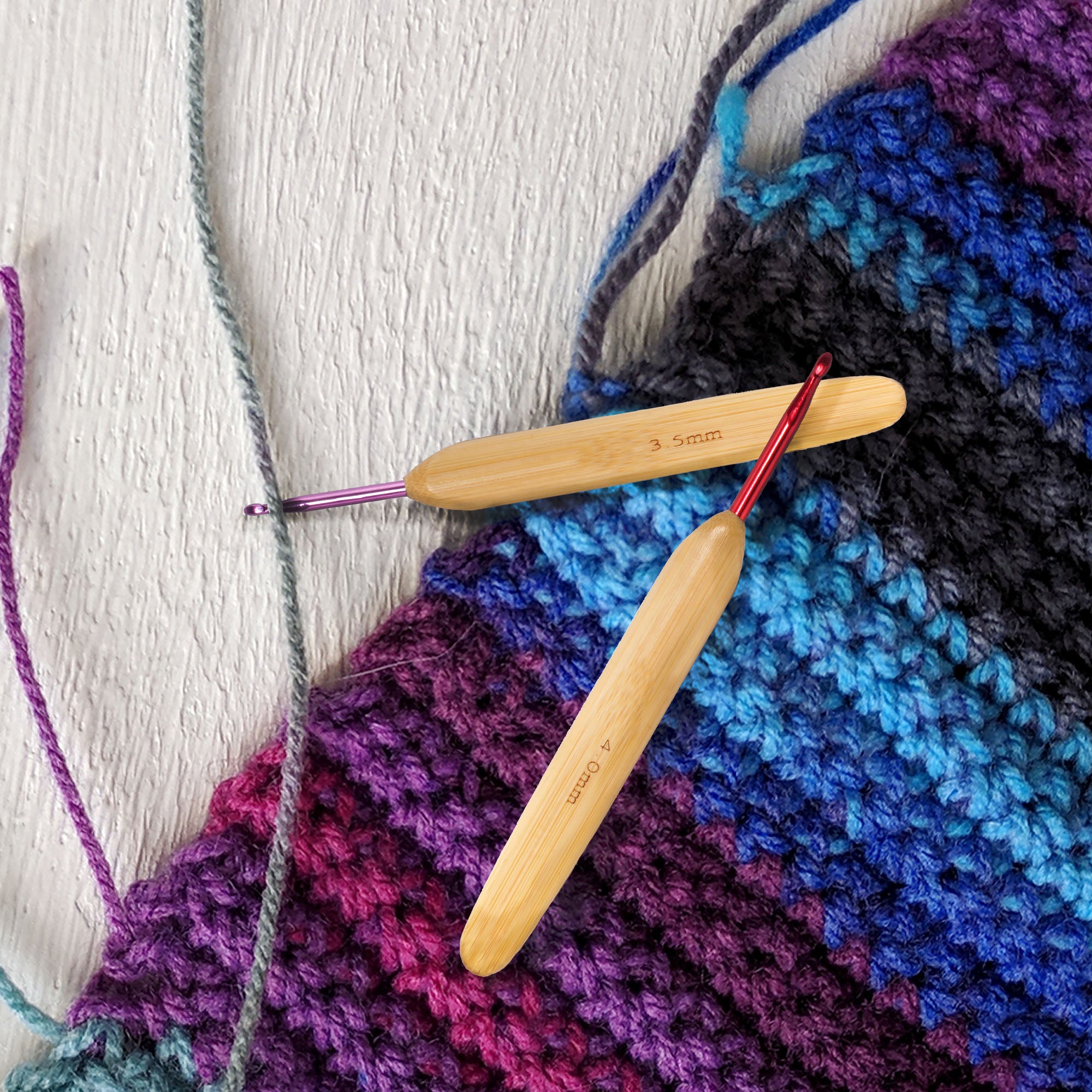purple and red hook with knitted item