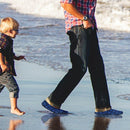 man walking in water shoes
