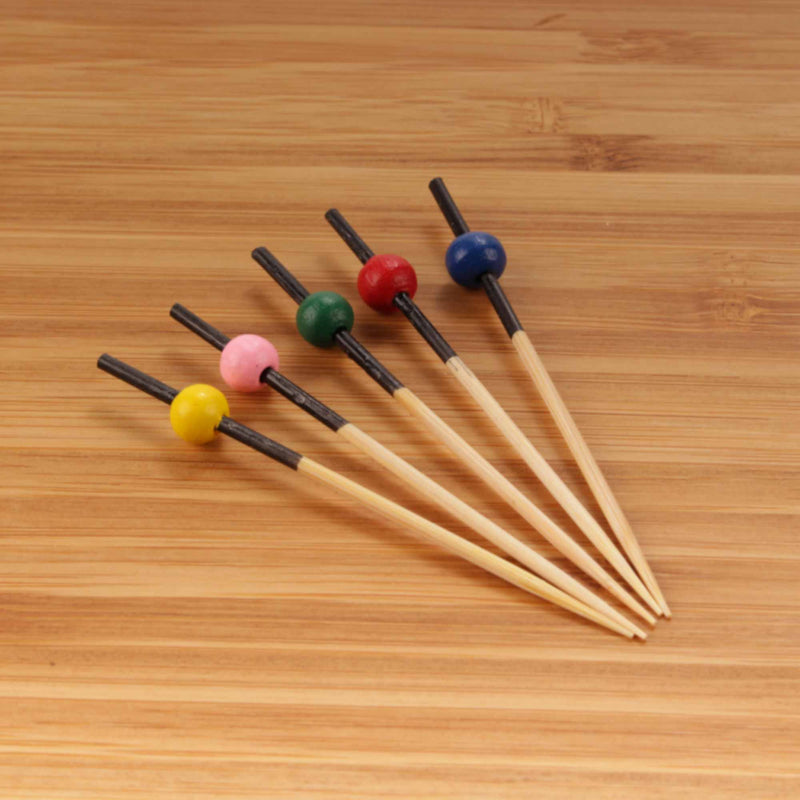 small bamboo ball picks assorted colors on bamboo surface