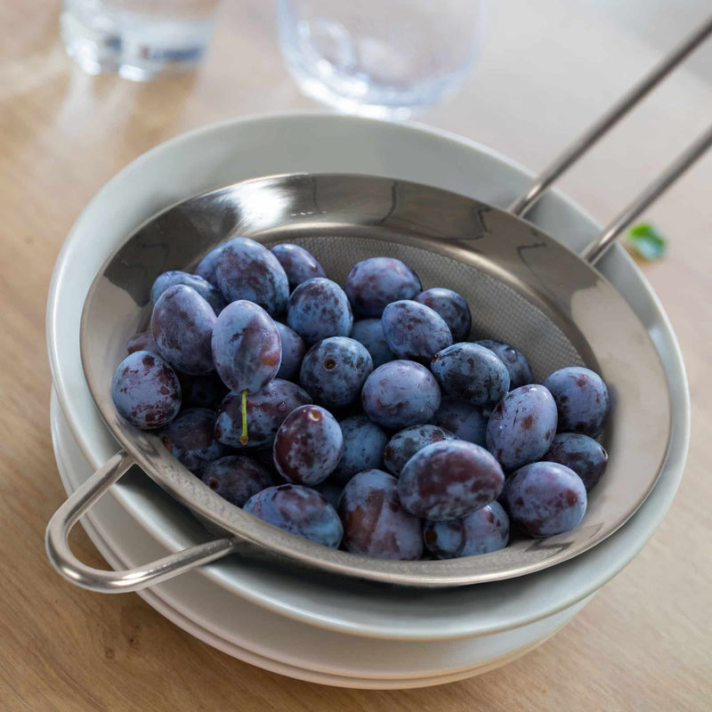 straining fruit blueberries