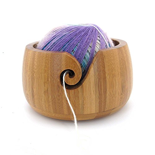 bowl holding a ball of galaxy fantasy yarn